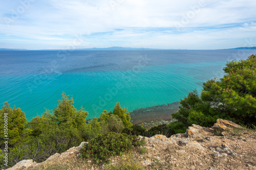 Amazing beautiful sea landscape of Greece. View from above at blue transparent sea water. Horizontal color photography.