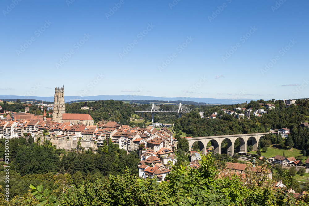 View of Fribourg medieval old town with bridges on a sunny day in Switzerland