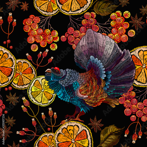 Wood grouse, lemon slice and red branches of a mountain ash berry, horizontal seamless pattern. Embroidery. Wild animals, template for clothes and t-shirt design