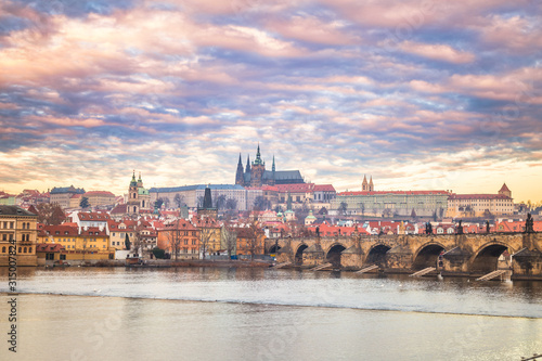 Prague Castle and Charles bridge above Vltava river early morning with beautiful sky, Czech Republic, Europe.