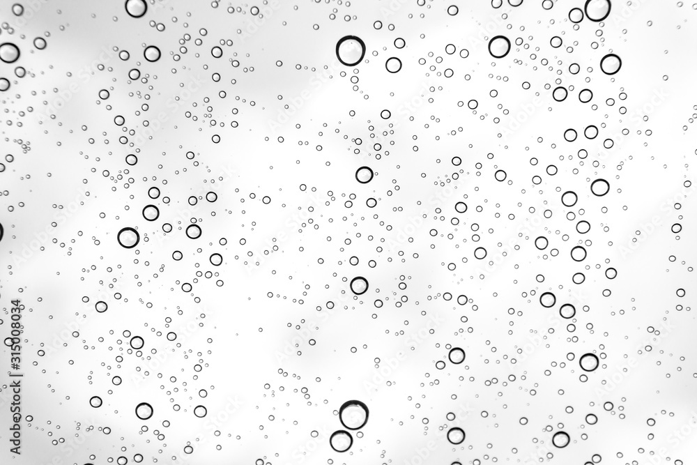 Rain drops on window glasses surface Natural Pattern of raindrops. Natural pattern of raindrops on white background for your design. Rain drops on window glasses surface Natural Pattern of raindrops. Natural pattern of raindrops on white background for your design.