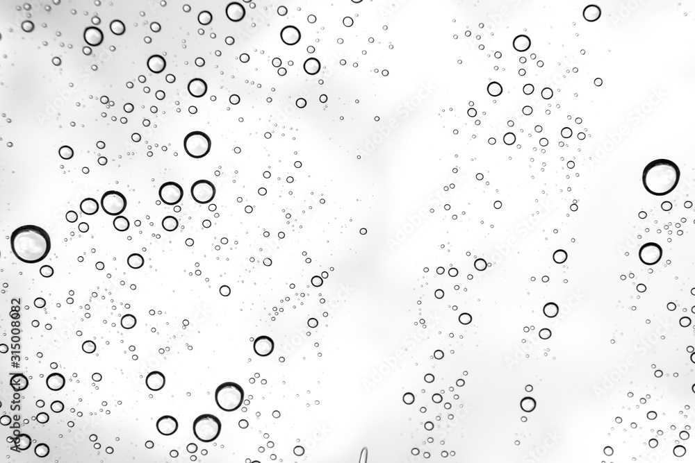 Rain drops on window glasses surface Natural Pattern of raindrops. Natural pattern of raindrops on white background for your design. Rain drops on window glasses surface Natural Pattern of raindrops. Natural pattern of raindrops on white background for your design.