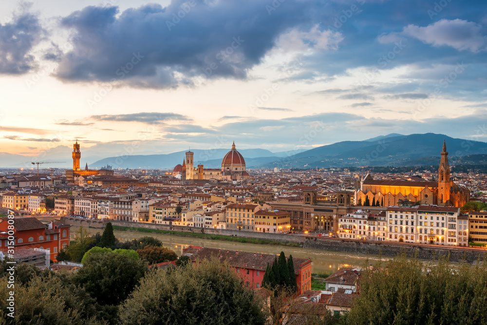 Amazing panoramic sunset view of Florence city, Italy with the river Arno, Palazzo Vecchio, Cathedral of Santa Maria del Fiore and Basilica of Santa Croce.