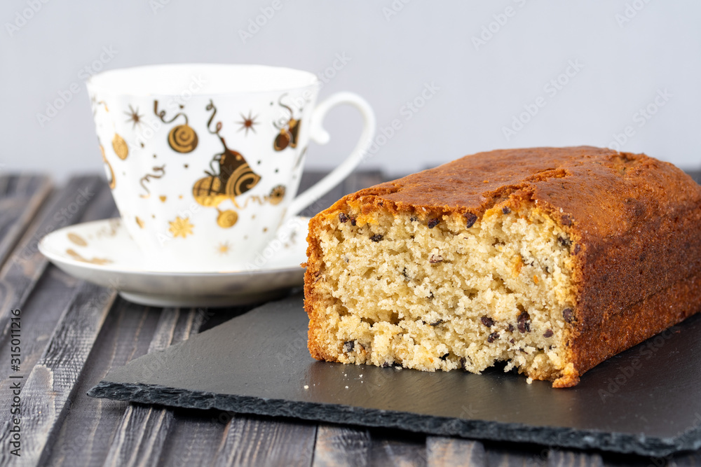 Fresh baked cupcake with cup of tea on light background Fresh baked cupcake with cup of tea on light background