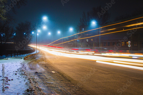 Road at night with light lines from headlights © Александр Шуков