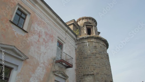 Abandoned fortress tower old brick mansion house ruined facade exterior 16th century Palace of Earl Xido in Khmelnik Ukraine photo