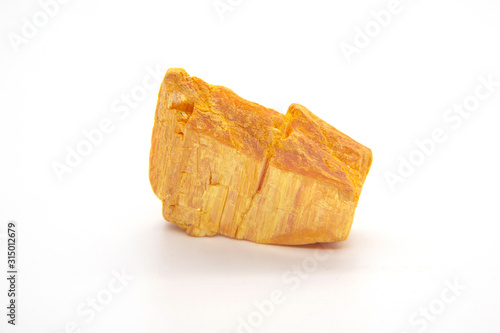 Orpiment mineral - arsenic sulfide isolated on white