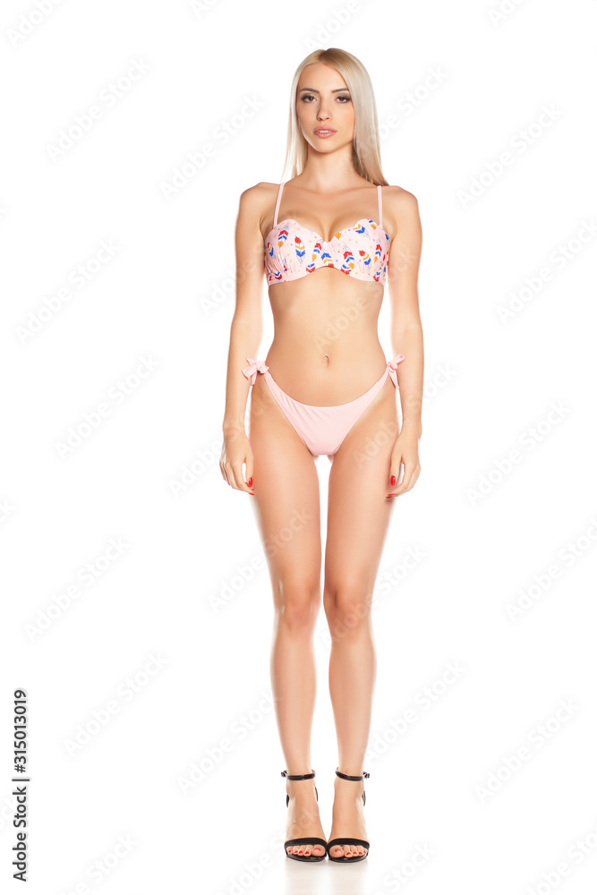 Young woman in bikini, isolated.