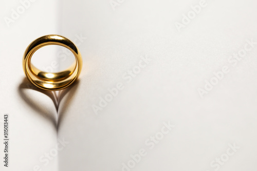 Golden wedding rings on book