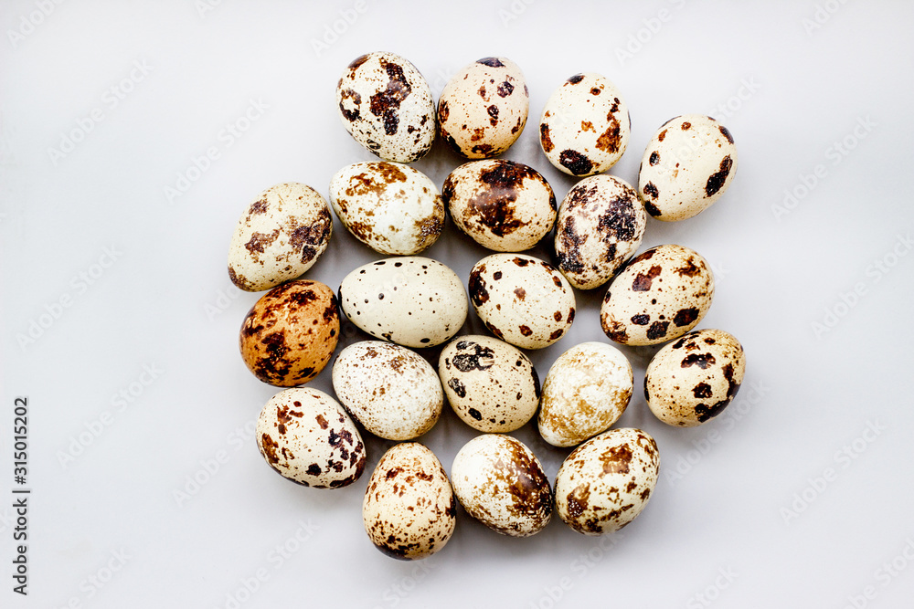 Quail eggs on a white background. View from above. Small Egg Isolate