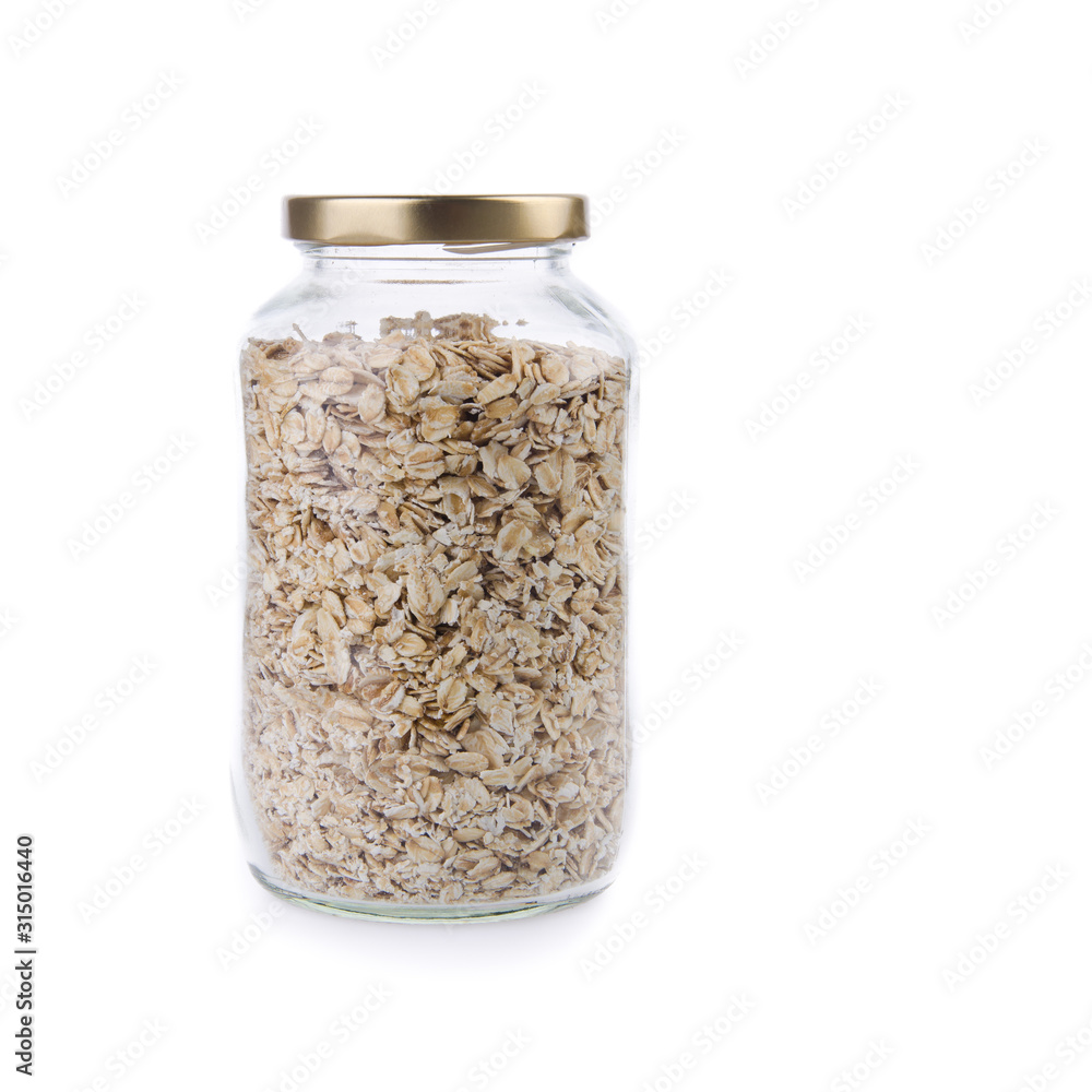 Oat flakes in a glass jar on a background new. Oat flakes in a glass jar on a background new.