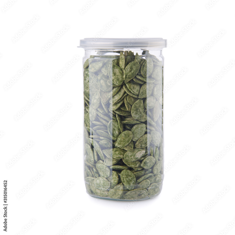 pumpkin seeds in jar on a background new. pumpkin seeds in jar on a background new.