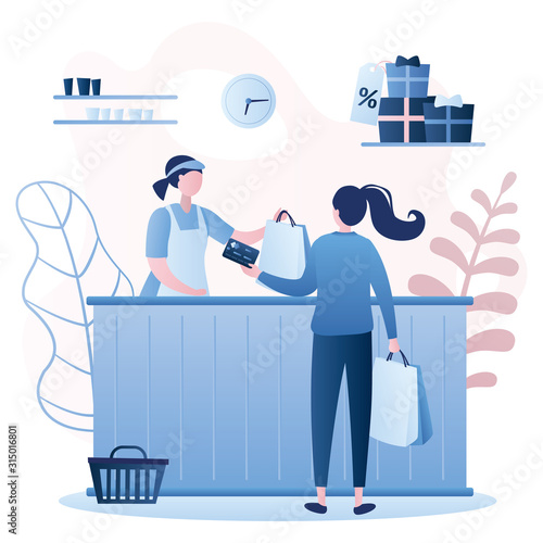 Woman buyer and female seller in a store, payment by card. Female character with shopping bags in hands,
