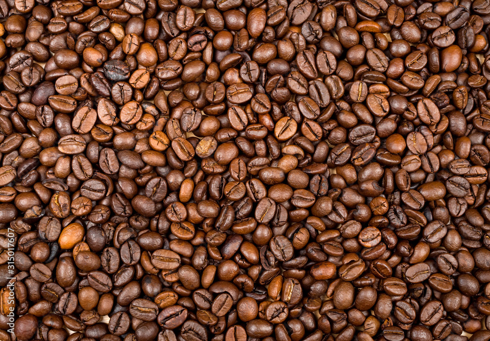 Naklejka premium Tekstury palonych ziaren kawy używane jako tło
