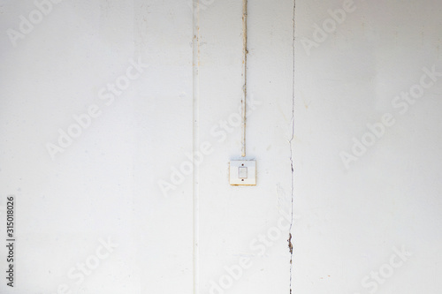 The switch lights installed on the concrete wall of old dilapidated look