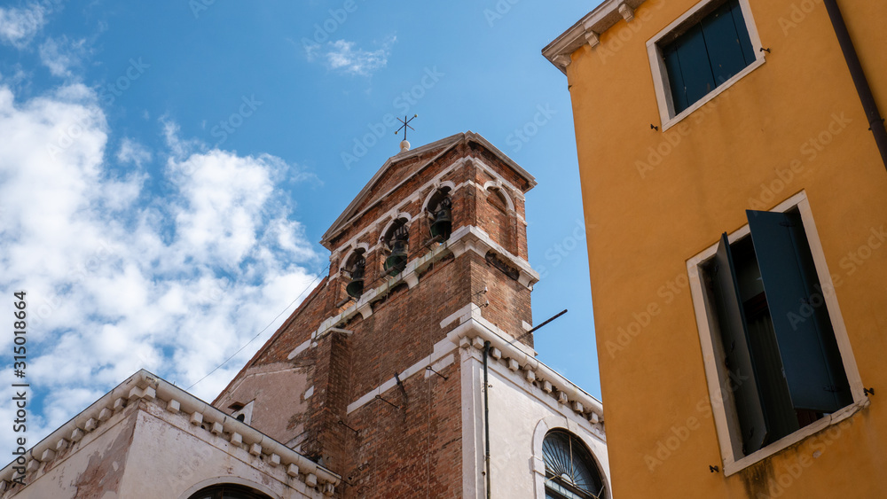 Church belfry with three bells in Venice, Italy.