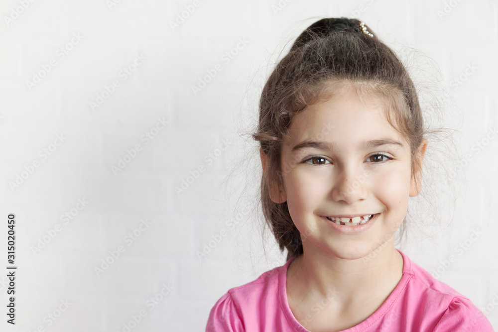 Portrait of happy smiling child girl on white background. Laughing people. Positive emotions. Portrait of happy smiling child girl on white background. Laughing people. Positive emotions.