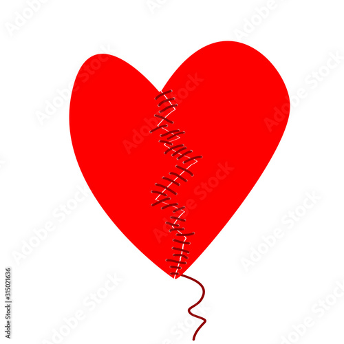 Fixing a broken heart concept with two halves of heart sewed
