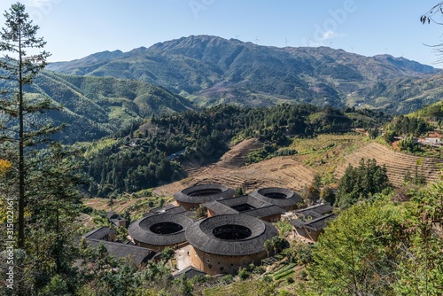 Traditional Chinese earth buildings of Hakka, The famous Nanjing Earth Building in Fujian Provence, China photo