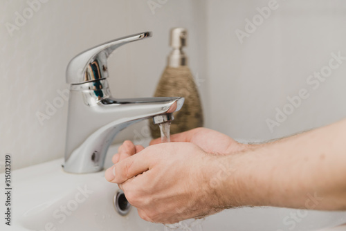 draw water in the palm of your hand from the tap. wash with running water. clean piped water at home.