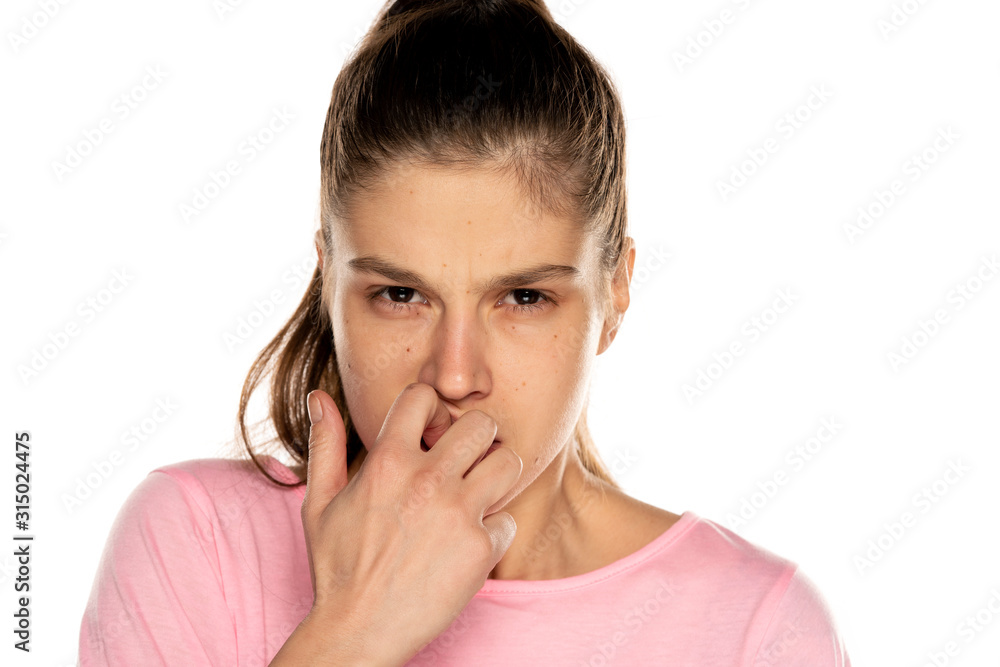 Portrait of young nervous woman bitimg her nails Portrait of young nervous woman bitimg her nails