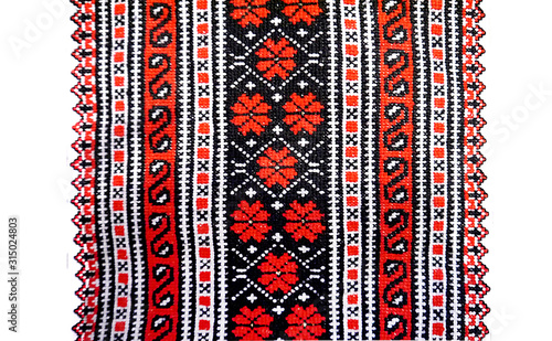 Handmade Ukrainian embroidery on fabric. Embroidered floral pattern. Beautiful flowers.