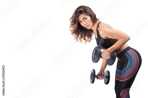 woman athlete doing exercises using sports equipment