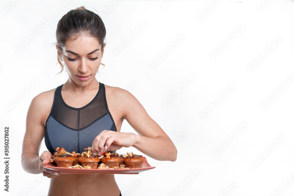 woman athlete holding dessert in her hands woman athlete holding dessert in her hands