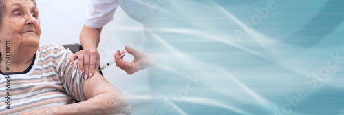 Senior woman getting an injection; panoramic banner