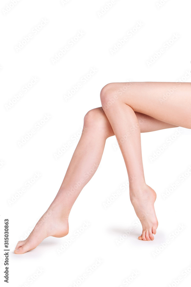 female legs on a white background in studio female legs on a white background in studio