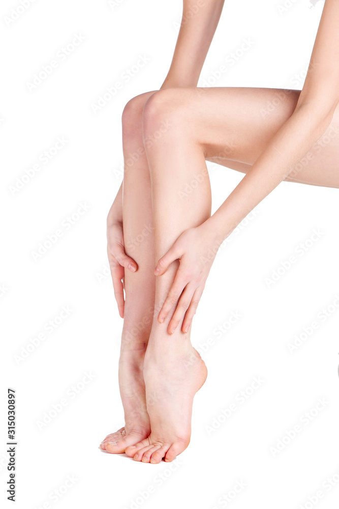 female legs on a white background in studio female legs on a white background in studio