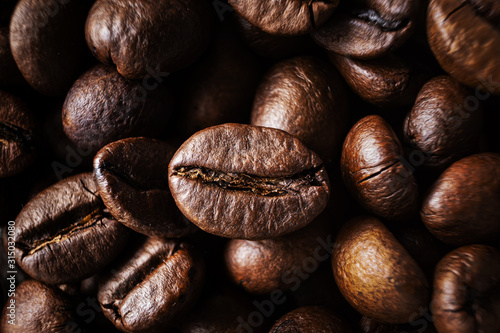 Coffee beans close-up, macro photo. Dark contrast photo.