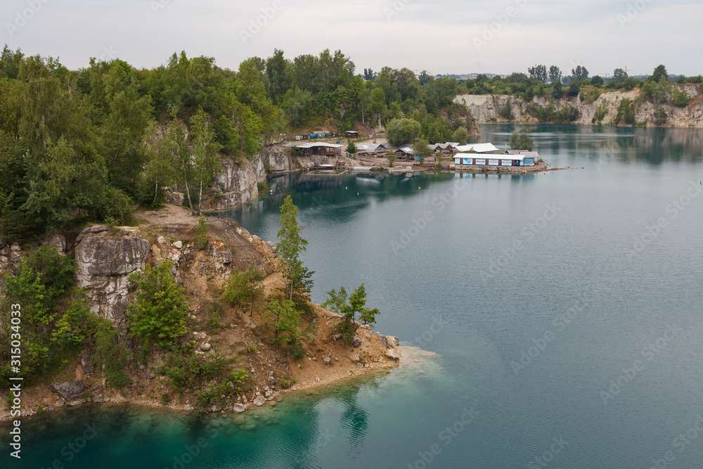 KRAKOW, POLAND - MAY, 2, 2018: Zakrzowek Lagoon, former quarry with clean azure water. Cracow, Poland.