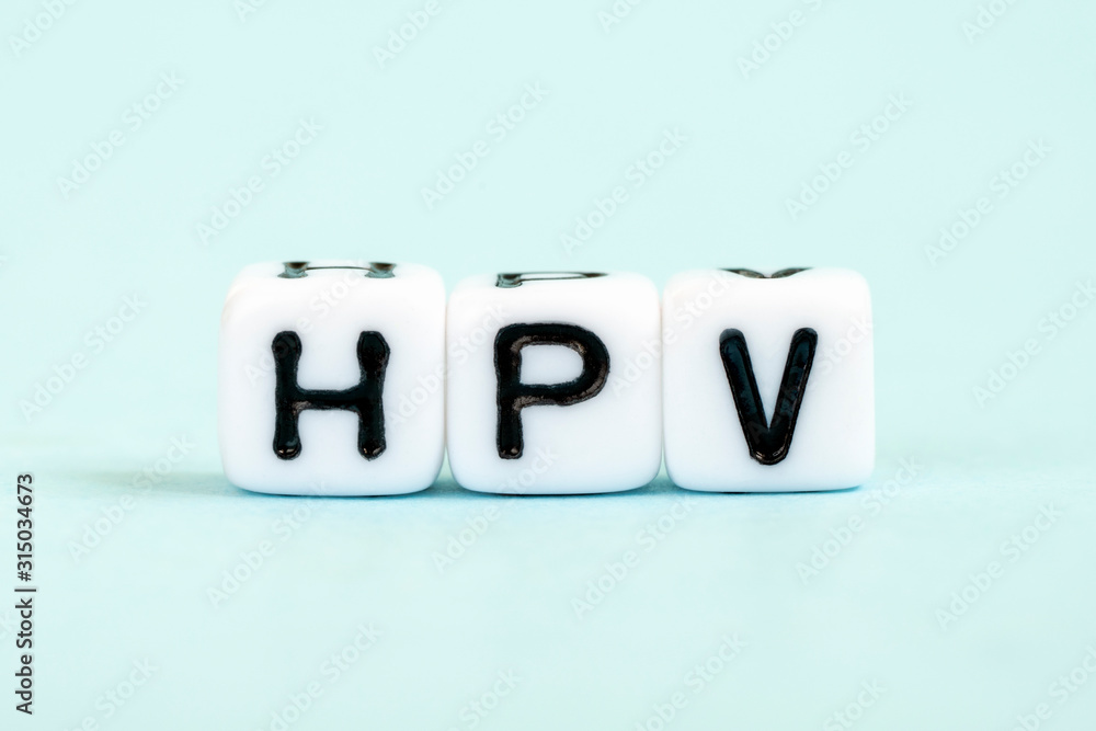 HPV - Human papillomavirus, word written on blocks. Humani Papilloma Virus inscription on blue background. Medical viruses concept HPV - Human papillomavirus, word written on blocks. Humani Papilloma Virus inscription on blue background. Medical viruses concept