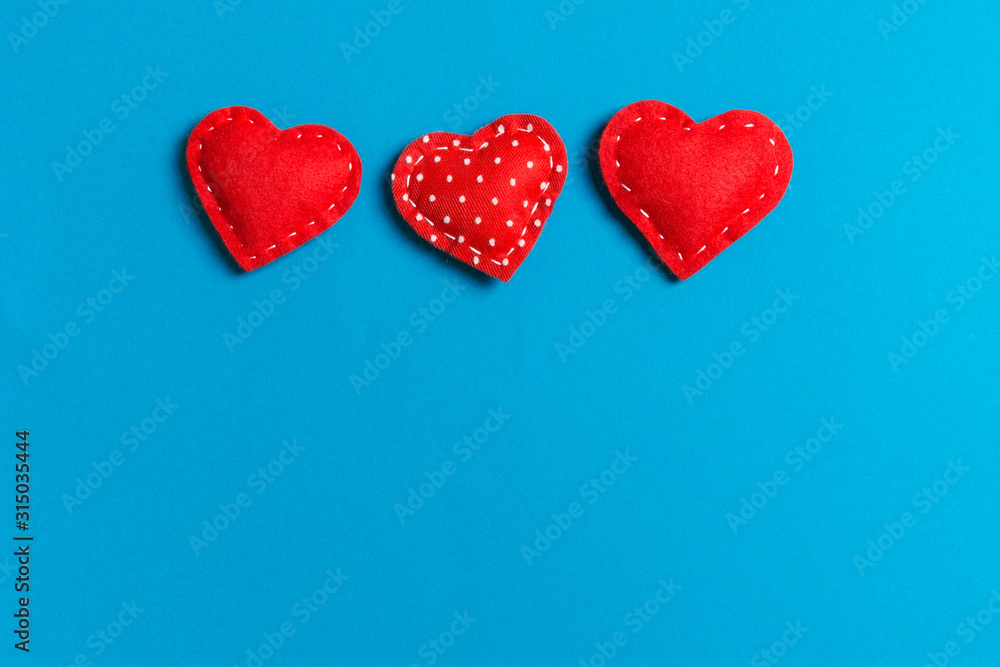 Top view of textile hearts on colorful background. Valentine's day concept with copy space Top view of textile hearts on colorful background. Valentine's day concept with copy space