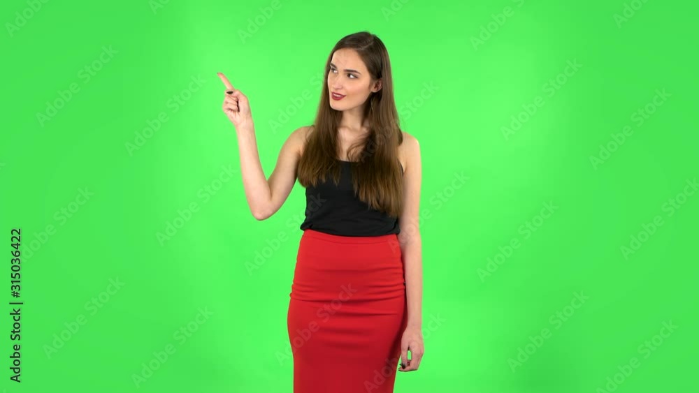 Woman talking and pointing side hand for something, copy space. Green screen Woman talking and pointing side hand for something, copy space. Green screen