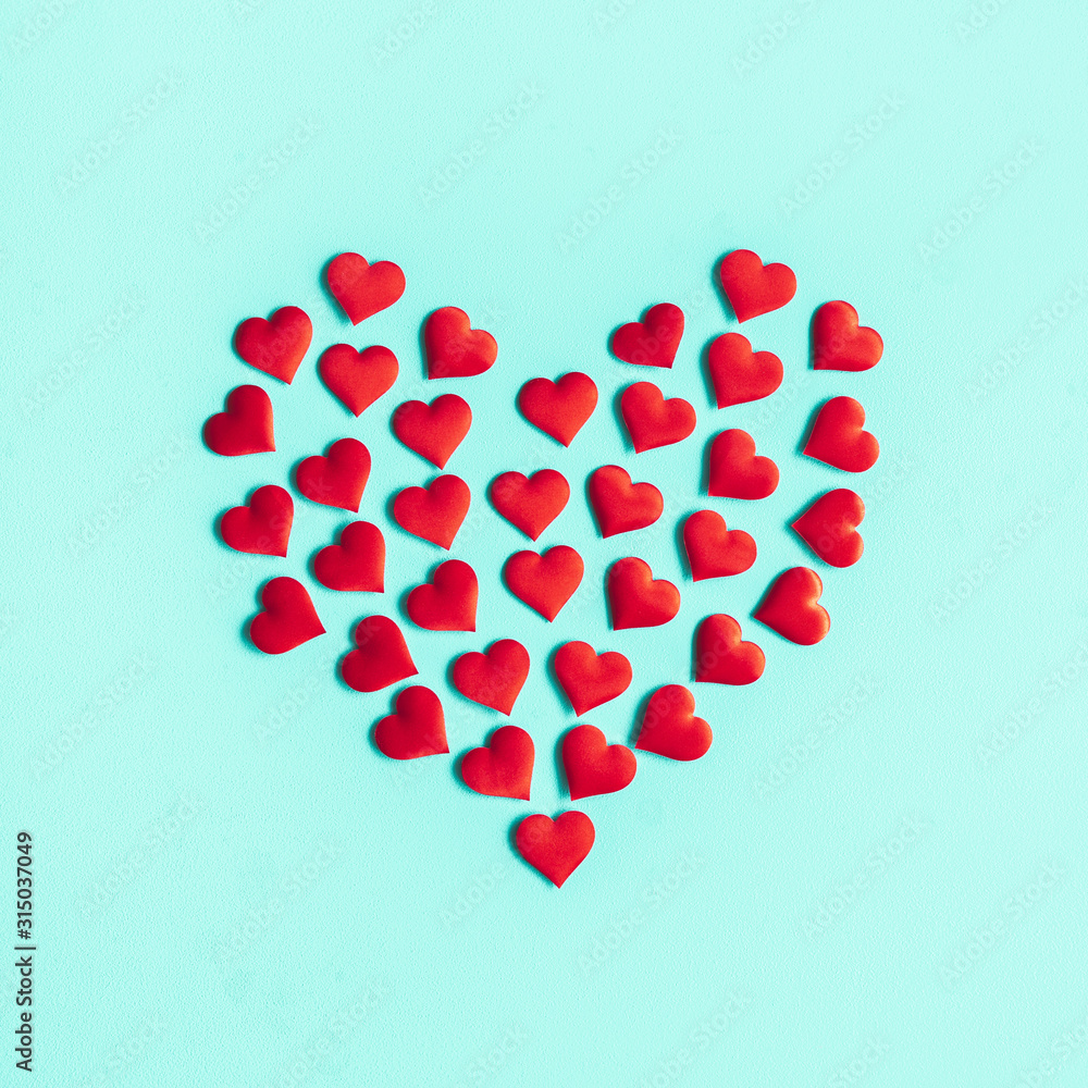 Valentine's Day background. Red hearts on pastel blue background. Valentines day concept. Flat lay, top view