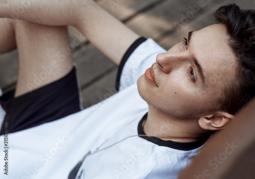 Closeup portrait of young man looking far away.