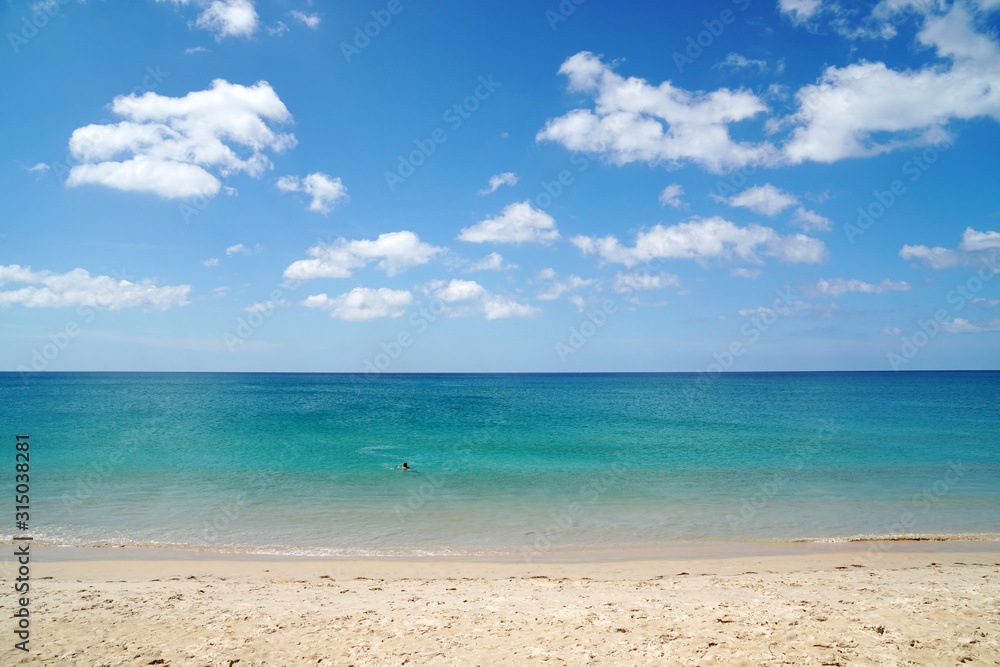 Nature seascape of Clouds blue sky and blue sea at Mai Khao beach near Phuket airport  thailand - Blue nature backdrop background with copy space text