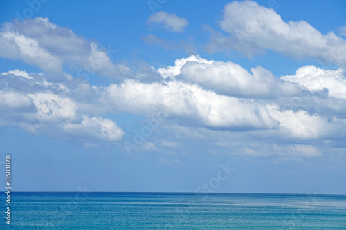 Nature seascape of Clouds blue sky and blue sea at Mai Khao beach near Phuket airport thailand - Blue nature backdrop background with copy space text