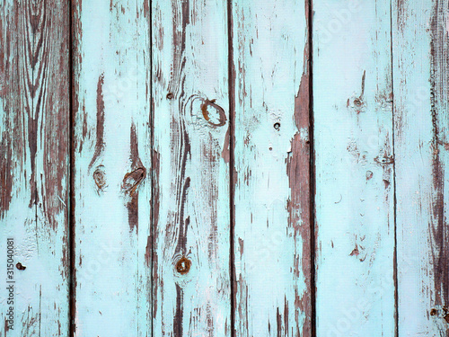 Old damaged boards texture. Wooden fence in pastel colors.