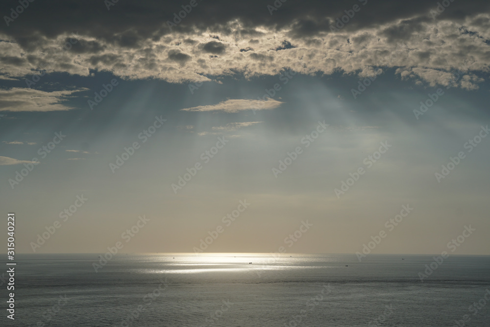 Nature seascape of Tranquil scene Light passing through the clouds on sunset over the ocean at phuket Thailand. Nature seascape of Tranquil scene Light passing through the clouds on sunset over the ocean at phuket Thailand.