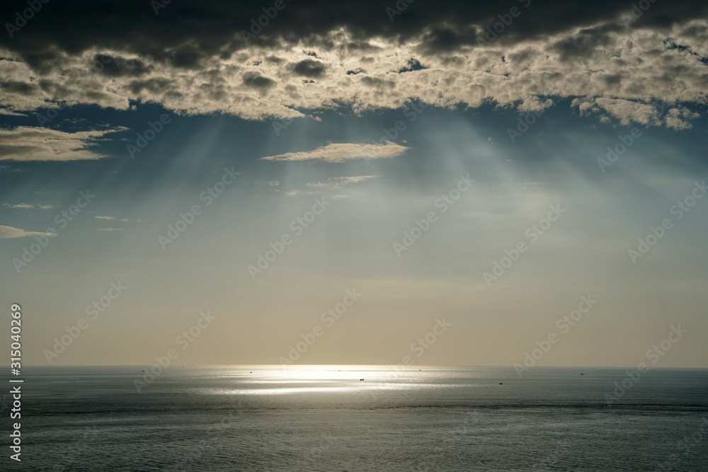 Nature seascape of Tranquil scene Light passing through the clouds on sunset over the ocean at phuket Thailand. Nature seascape of Tranquil scene Light passing through the clouds on sunset over the ocean at phuket Thailand.