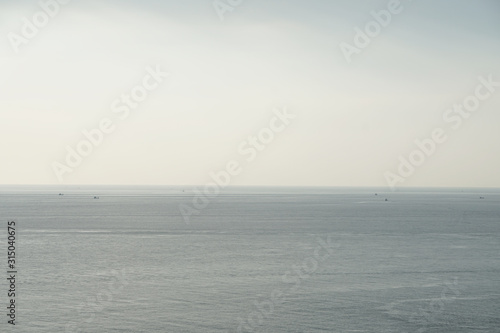 Tranquil scene of horizon seascape blue sea with clearly sky at phuket thailand - Blue gradient nature Backdrop background  © kittinit