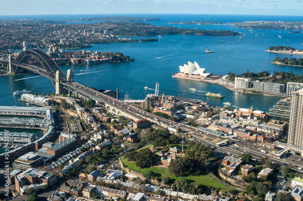 Fototapeta premium Aerial view of Sydney cityscape with Sydney Harbour and landmarks