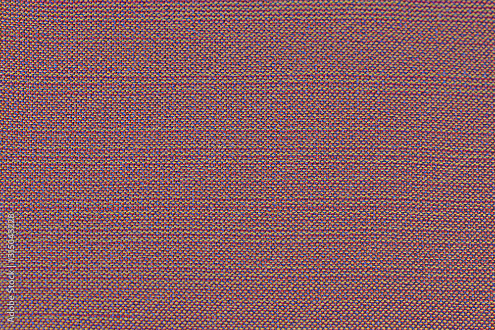 Fototapeta premium The background of the cloth fabric with smooth lines. Texture of rough red fabric surface with yellow fabric with seam in line.