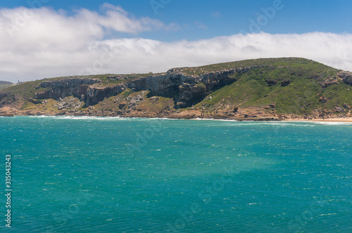 Summer coast landscape with cliffs and mountains