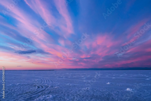 purple blue sunset or sunrise in winter over the river