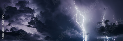Fototapeta Thunderstorm with lightning bolts, banner image.