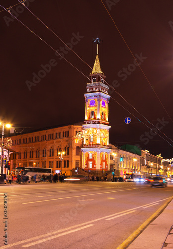 Saint Petersburg. Nevskiy Avenue in the Christmas holidays. Beautiful festive illumination on the tower of the City Duma